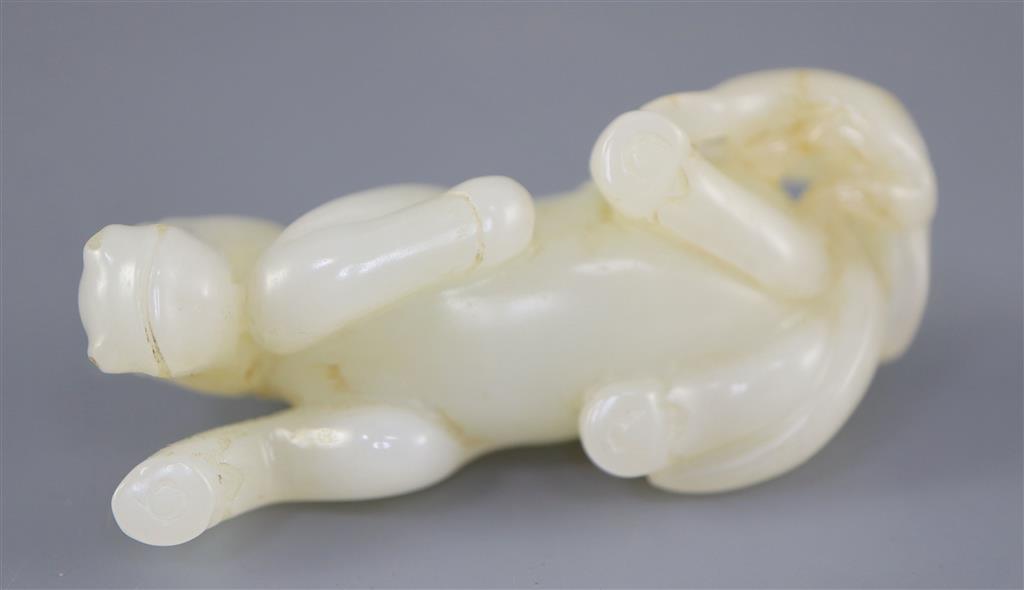 A Chinese white jade group of a recumbent horse and boy, 6cm long